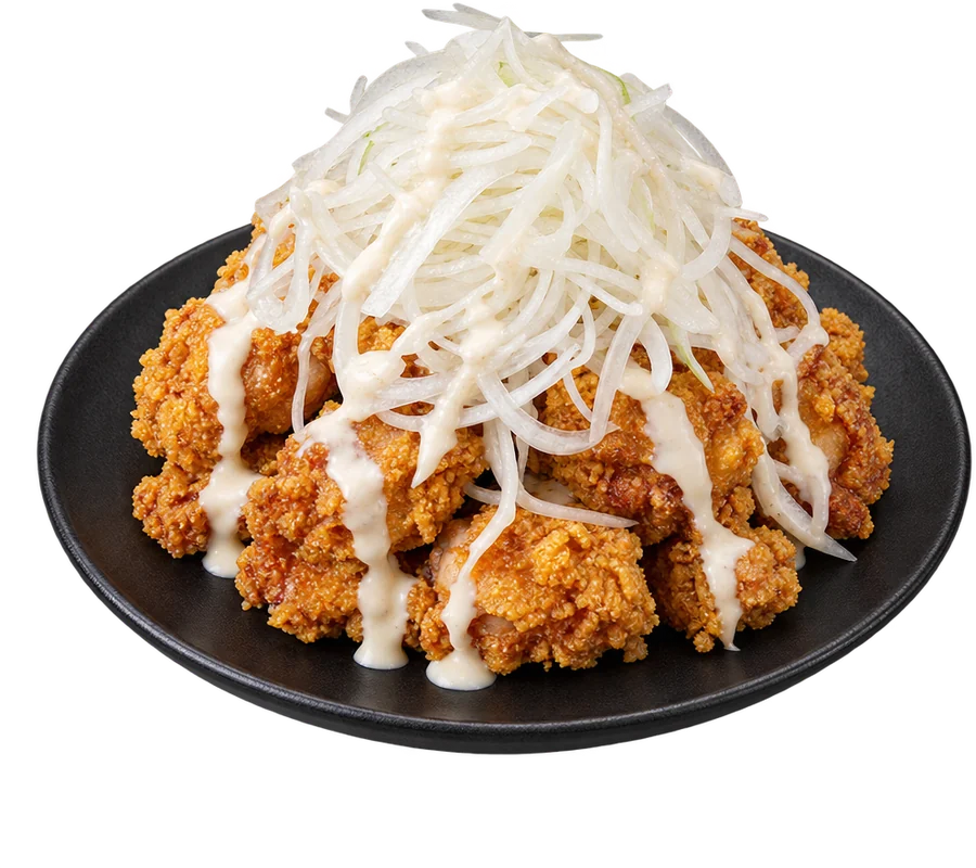 Snow onion fried chicken topped with sliced onions and creamy white sauce